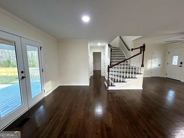 interior space with french doors, crown molding, stairway, wood finished floors, and baseboards