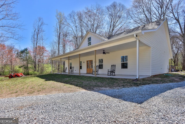 90 Jefferson Rd, Statham, GA 30666 - back of house featuring board and batten siding, a patio area, and a ceiling fan