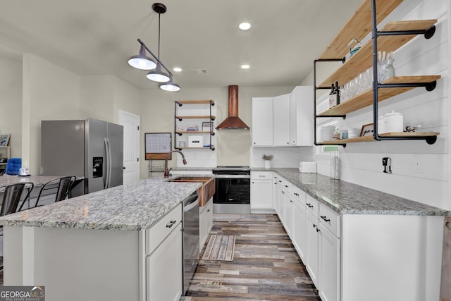 90 Jefferson Rd, Statham, GA 30666 - kitchen featuring wall chimney range hood, open shelves, wood finished floors, a sink, and stainless steel appliances
