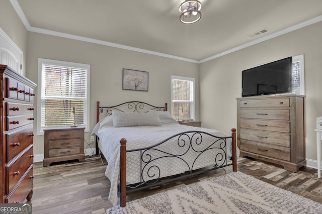 90 Jefferson Rd, Statham, GA 30666 - bedroom featuring baseboards, ornamental molding, wood finished floors, and visible vents