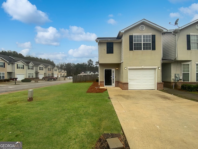 view of front of house featuring an attached garage, brick siding, concrete driveway, stucco siding, and a front yard