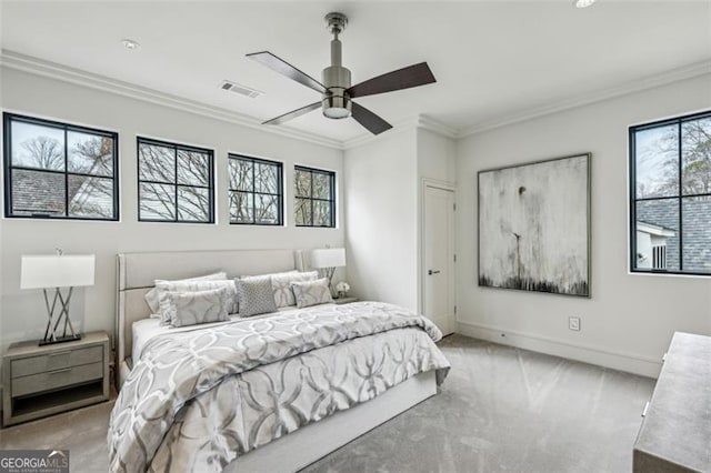 bedroom featuring visible vents, ornamental molding, carpet, baseboards, and ceiling fan