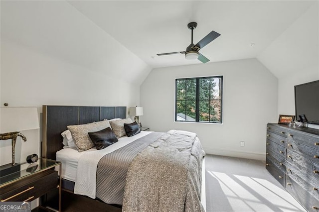 bedroom featuring ceiling fan, baseboards, carpet, and vaulted ceiling