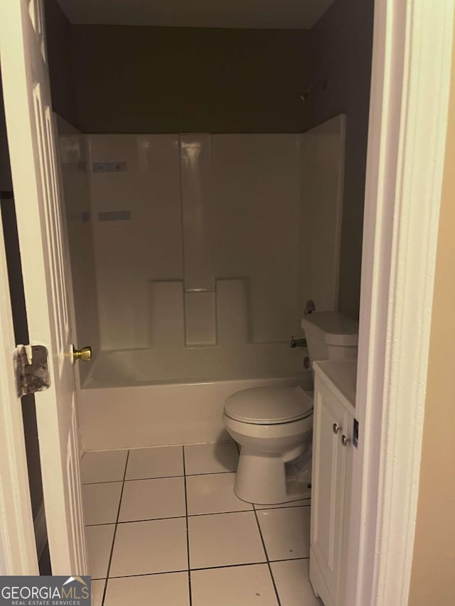 bathroom featuring shower / bath combination, vanity, toilet, and tile patterned floors