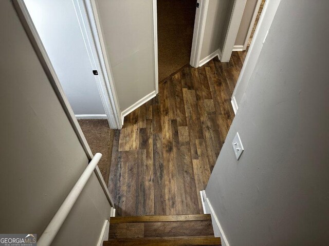bathroom with wood finished floors, baseboards, vanity, and a textured ceiling