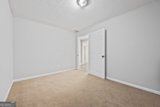 stairway with wood finished floors and baseboards