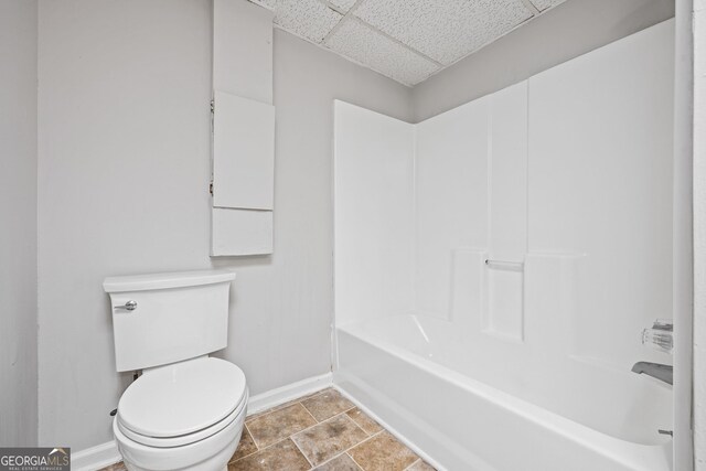 stairway featuring wood finished floors and ceiling fan