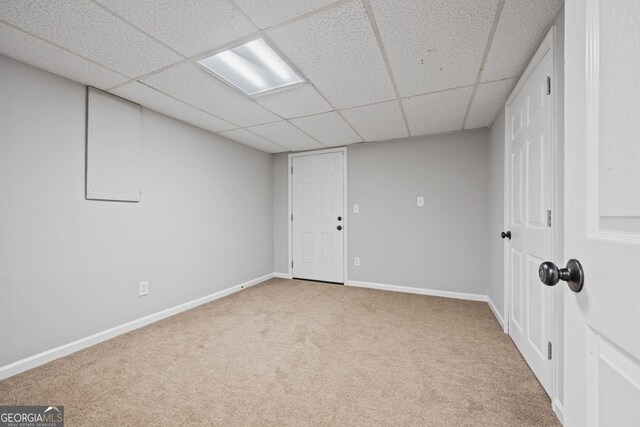 carpeted empty room featuring baseboards and a textured ceiling