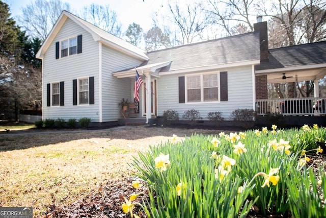 traditional-style home featuring a chimney