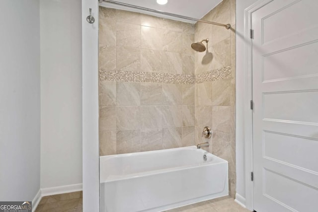 full bathroom featuring tile patterned flooring, shower / bath combination, and baseboards