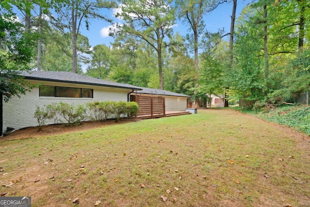 view of yard featuring a wooden deck