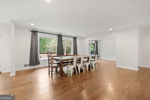 dining area featuring light wood finished floors, visible vents, and recessed lighting