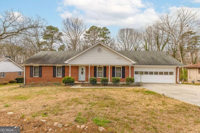 ranch-style house featuring driveway, a garage, a front lawn, and brick siding