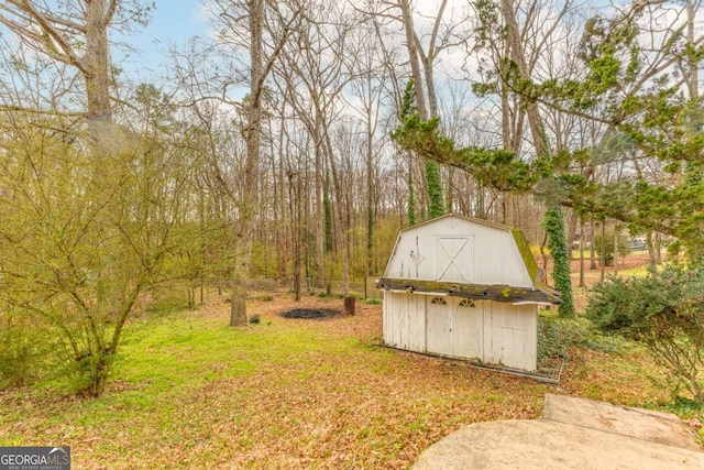 view of yard with an outbuilding and a storage shed