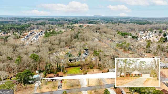 drone / aerial view with a view of trees