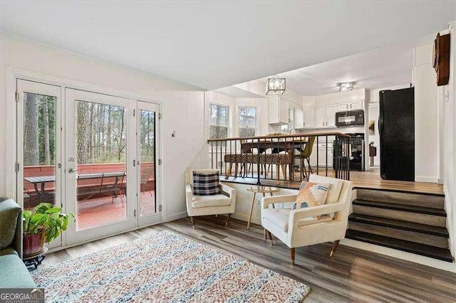 living area with wood finished floors and baseboards