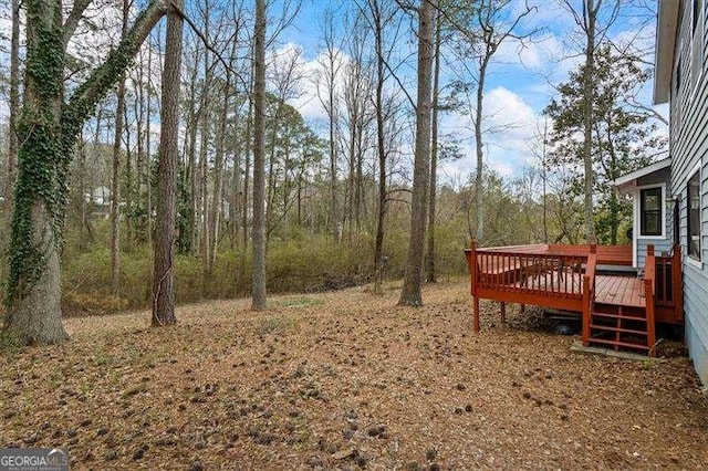 view of yard with a wooden deck