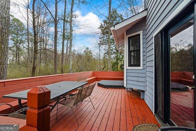 wooden deck with outdoor dining area