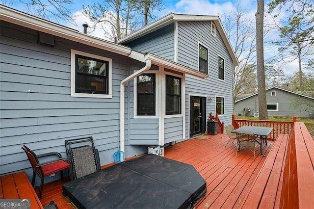 wooden deck with outdoor dining space