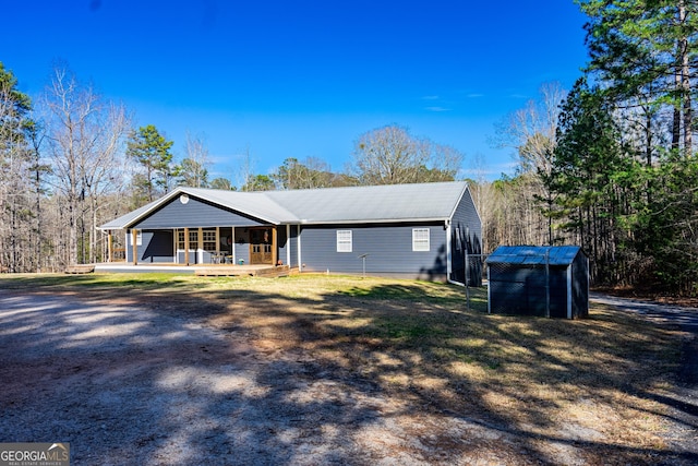 ranch-style house with metal roof