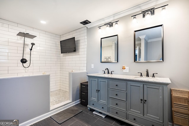 full bathroom featuring double vanity, a walk in shower, and a sink