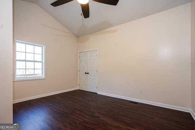 unfurnished room featuring high vaulted ceiling, a ceiling fan, baseboards, and dark wood-type flooring