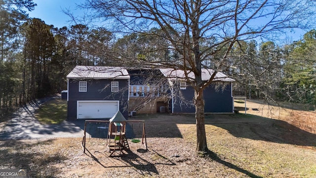 view of front of home featuring driveway and an attached garage