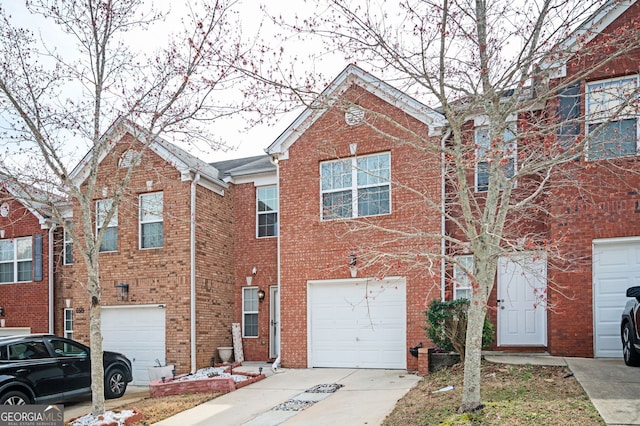 view of front of property featuring brick siding and an attached garage