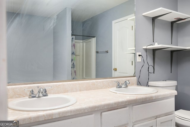 full bath with double vanity, a sink, toilet, and a shower with shower curtain