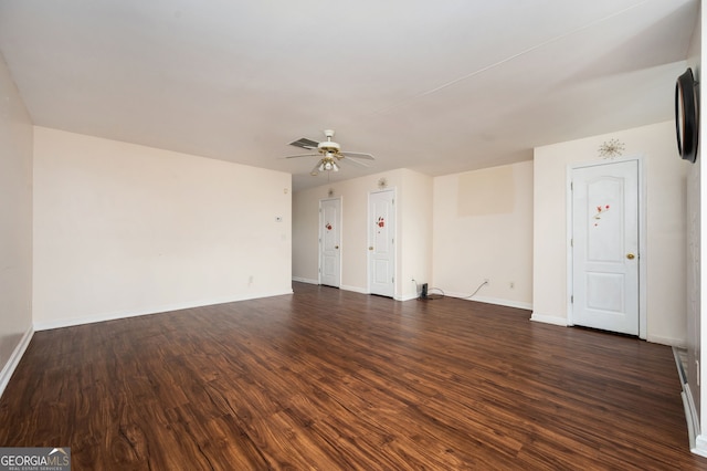 unfurnished living room featuring visible vents, baseboards, ceiling fan, and dark wood-style flooring