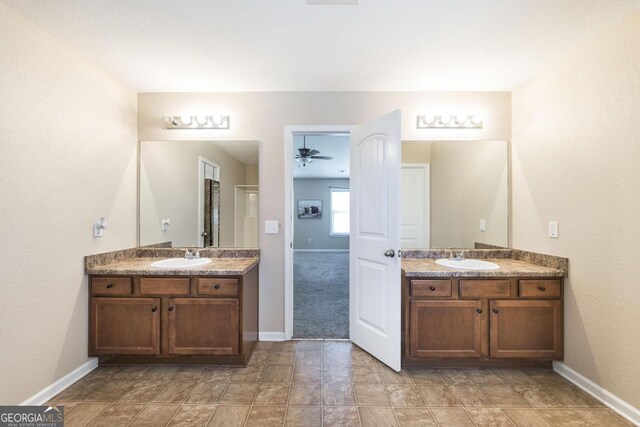 141 Back Cedar Ln, Warner Robins, GA 31093 - bathroom featuring toilet, double vanity, a sink, and visible vents
