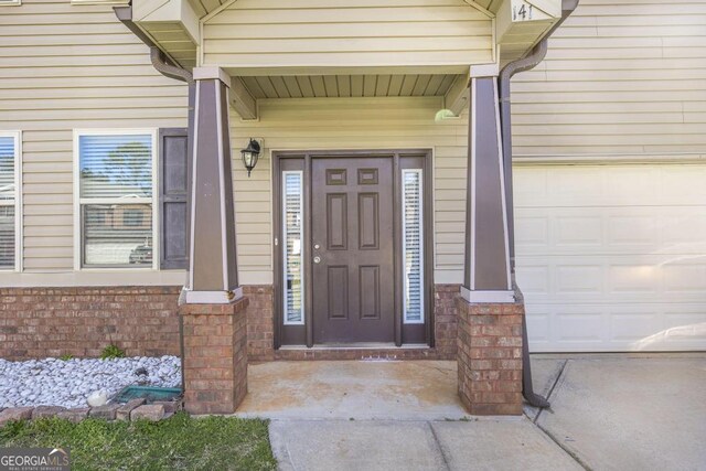 141 Back Cedar Ln, Warner Robins, GA 31093 - view of exterior entry with brick siding