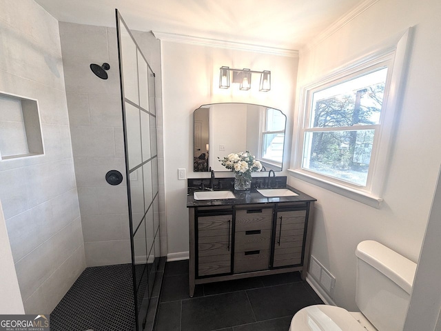 full bath with tile patterned floors, a sink, toilet, walk in shower, and crown molding