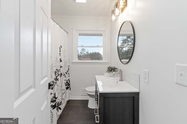 bathroom featuring crown molding, vanity, toilet, tile patterned flooring, and visible vents