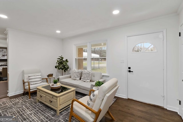 living area with recessed lighting, a wealth of natural light, crown molding, and dark wood-style floors