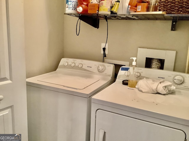 laundry area featuring laundry area and washer and clothes dryer