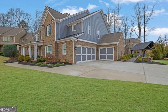 view of front facade featuring brick siding, an attached garage, concrete driveway, and a front yard