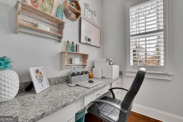 office with baseboards and wood finished floors