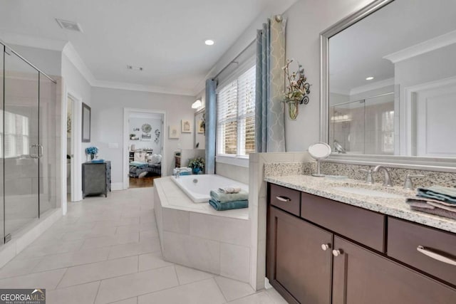 bathroom with vanity, ornamental molding, a stall shower, a bath, and visible vents