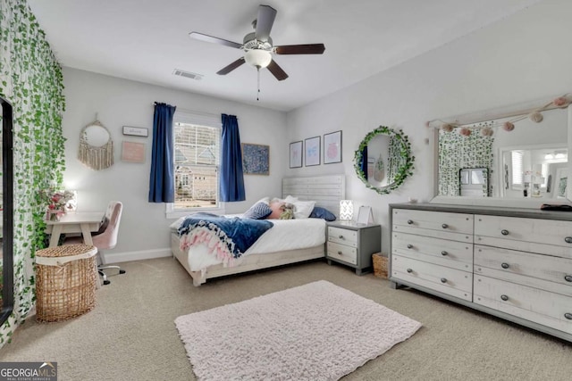 bedroom featuring light carpet, visible vents, baseboards, and a ceiling fan