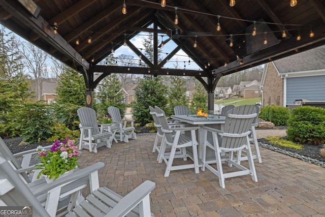 view of patio / terrace with an outdoor fire pit and a gazebo
