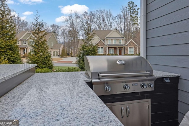 view of patio / terrace featuring a residential view and area for grilling