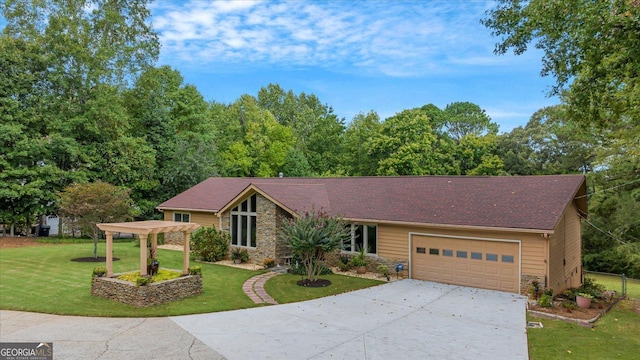 view of front of home with stone siding, an attached garage, a front lawn, and concrete driveway