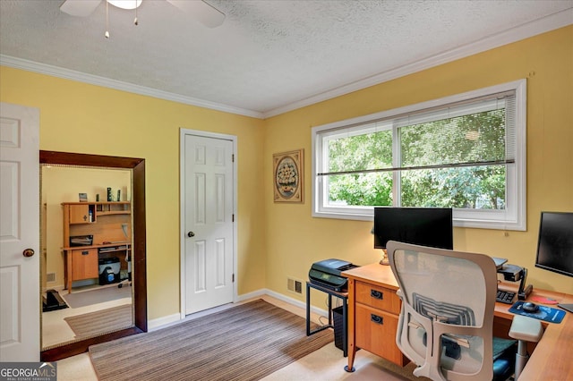 office area with a textured ceiling, ceiling fan, visible vents, baseboards, and crown molding