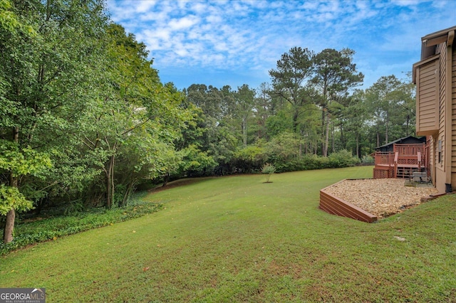 view of yard featuring a wooden deck