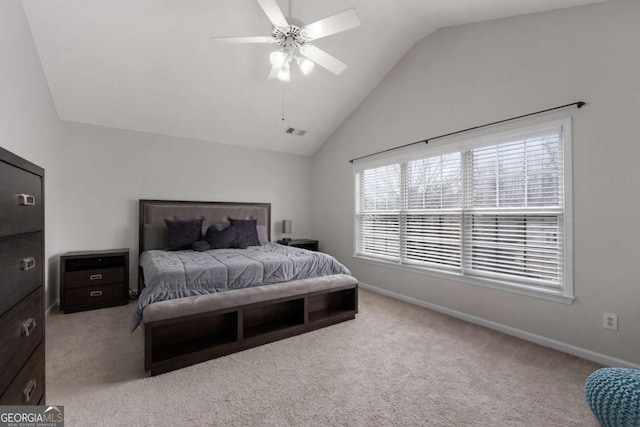 carpeted bedroom featuring a ceiling fan, lofted ceiling, visible vents, and baseboards