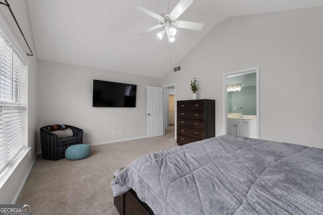 carpeted bedroom with baseboards, visible vents, ceiling fan, ensuite bathroom, and high vaulted ceiling