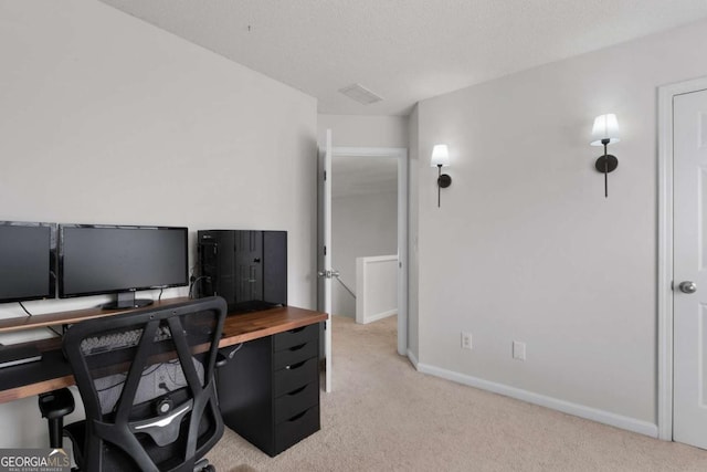 home office with baseboards, visible vents, a textured ceiling, and light colored carpet