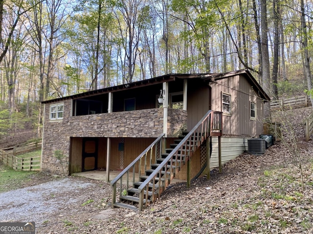 view of front of property featuring central air condition unit