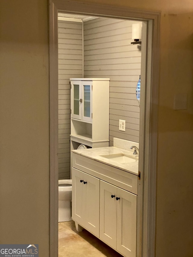 bathroom featuring vanity and toilet